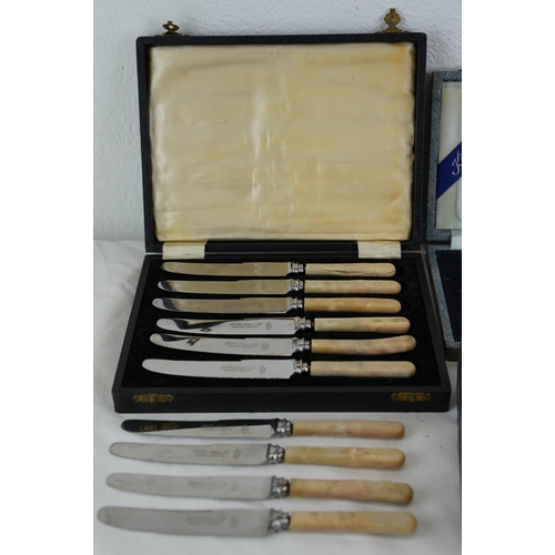 217 - Four vintage cased sets of cutlery.