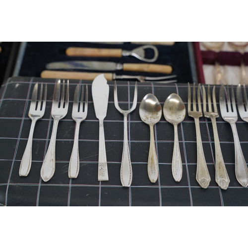 217 - Four vintage cased sets of cutlery.