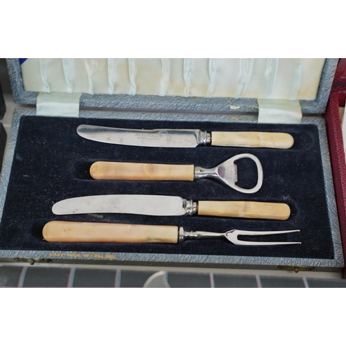 217 - Four vintage cased sets of cutlery.