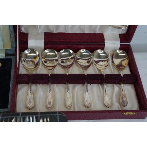 217 - Four vintage cased sets of cutlery.