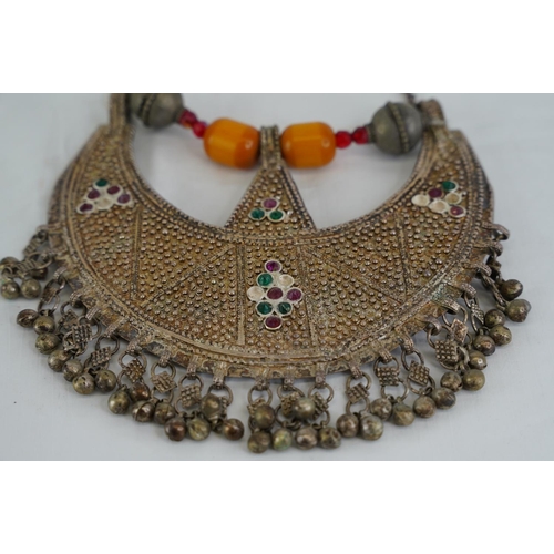 293 - A vintage decorative metal and beaded tribal style necklace.