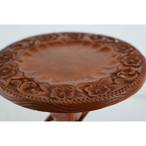 296 - A carved table top with a tripod base, 30cm x 30cm.