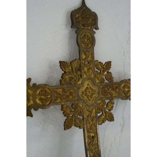 297 - A large decorative brass Cross, measuring 38cm x 26cm.