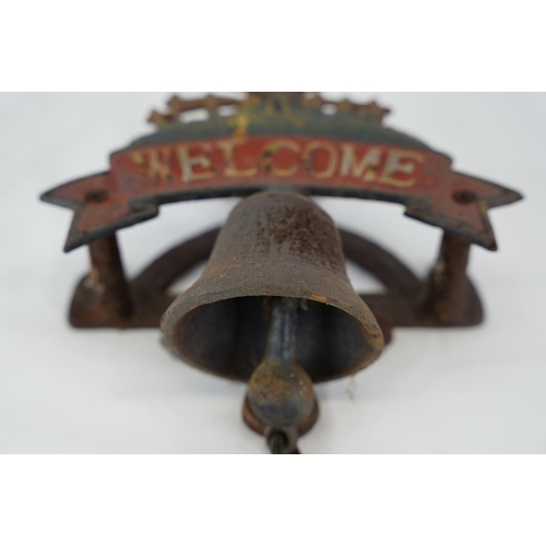 300 - A 'Welcome' cast iron bell.