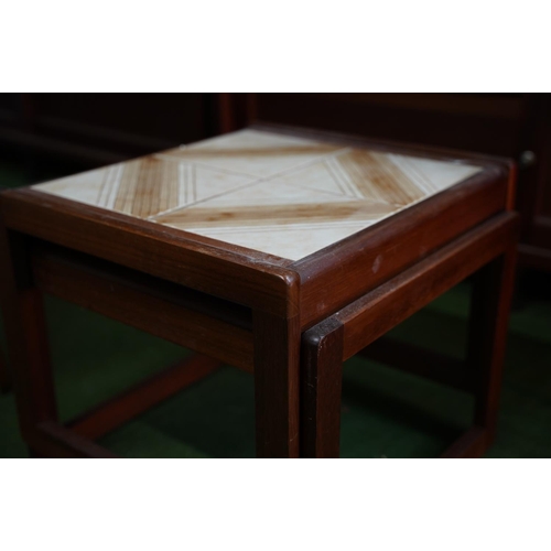 309 - A nest of two vintage tables with tile tops.