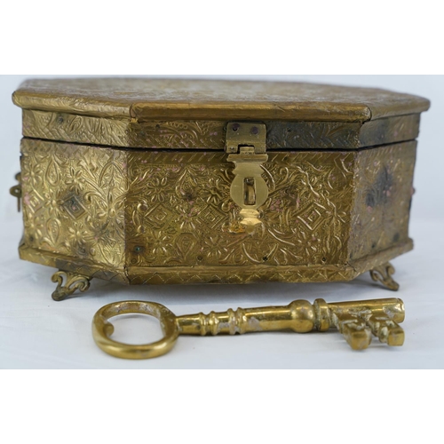 320 - A large decorative metal and wood box, a large brass key and more, measuring 29cm x 22cm.