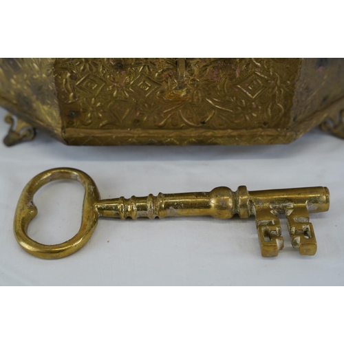 320 - A large decorative metal and wood box, a large brass key and more, measuring 29cm x 22cm.