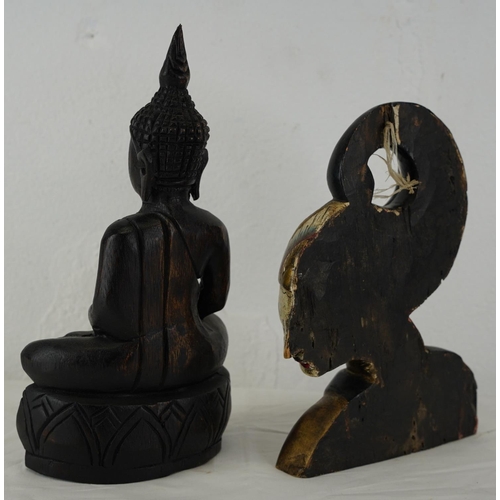 321 - A wooden Buddha and another wooden figure.