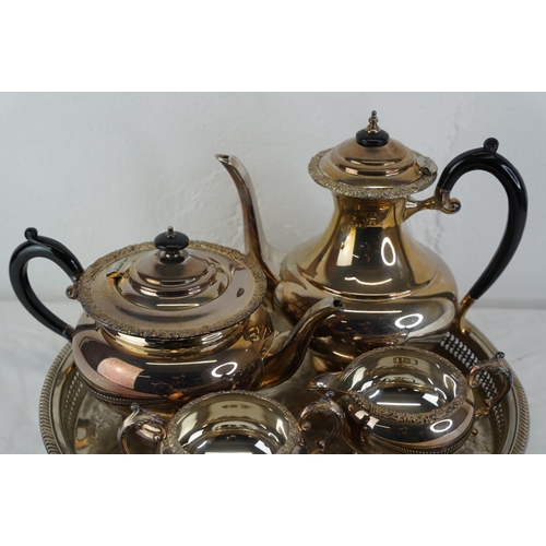 324 - A four piece silver plated tea service and tray.