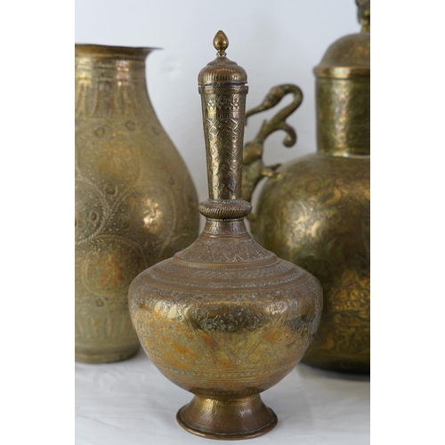 325 - A large lot of decorative Tibetan brass urns, vases and more.