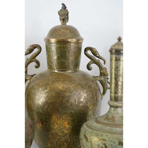 325 - A large lot of decorative Tibetan brass urns, vases and more.