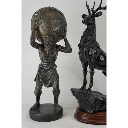 328 - A resin deer figure mounted on a wooden plinth, a spelter figure of a harvest lady and another statu... 