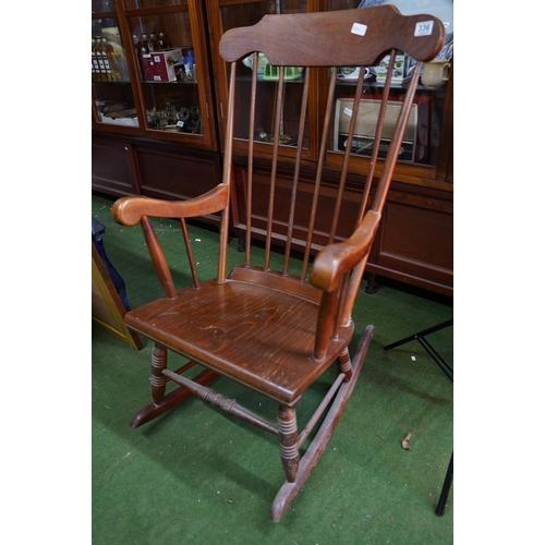 336 - A wooden rocking chair.