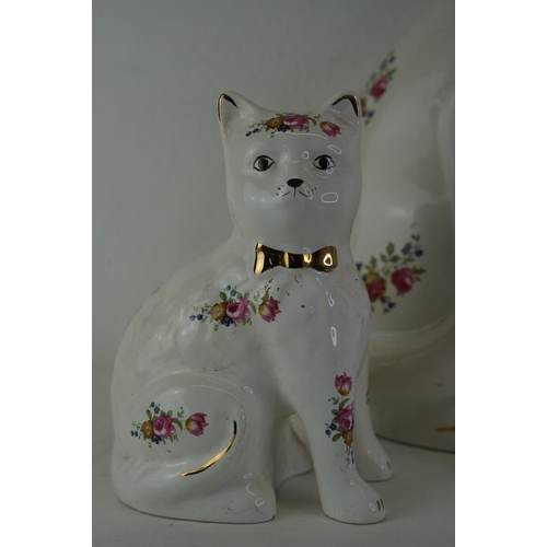 337 - A large ceramic cat ornament, measuring 37cm and another pair.