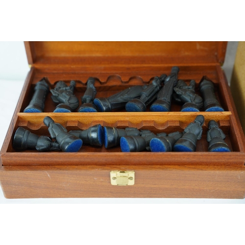 338 - Two sets of chess pieces in presentation boxes.