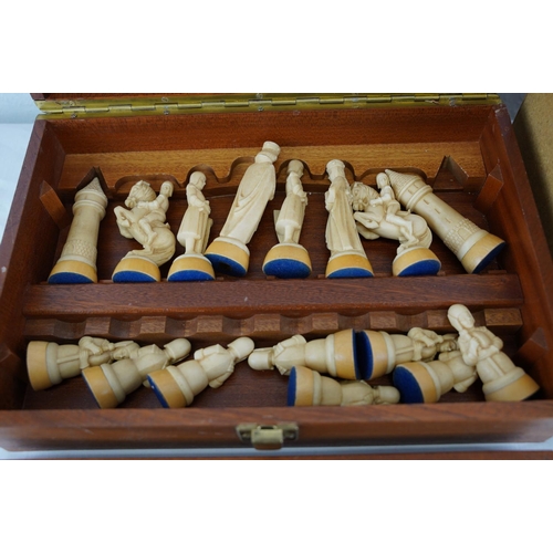 338 - Two sets of chess pieces in presentation boxes.