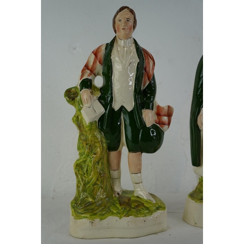 344 - Two Staffordshire figures 'Robert Burns' and 'Highland Mary', measuring 24cm.