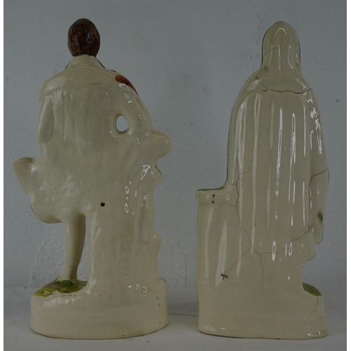 344 - Two Staffordshire figures 'Robert Burns' and 'Highland Mary', measuring 24cm.