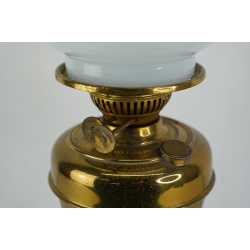 350 - A brass based oil lamp with white football shade.