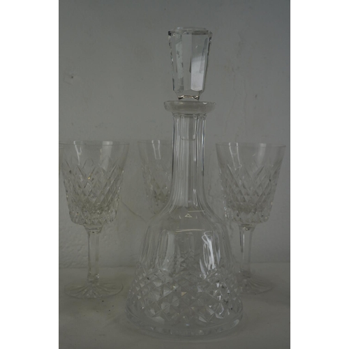 356 - A Waterford crystal decanter and a set of five large Tyrone crystal wine glasses.