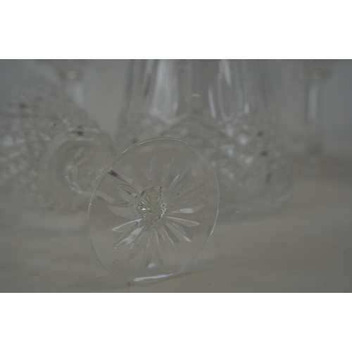 356 - A Waterford crystal decanter and a set of five large Tyrone crystal wine glasses.