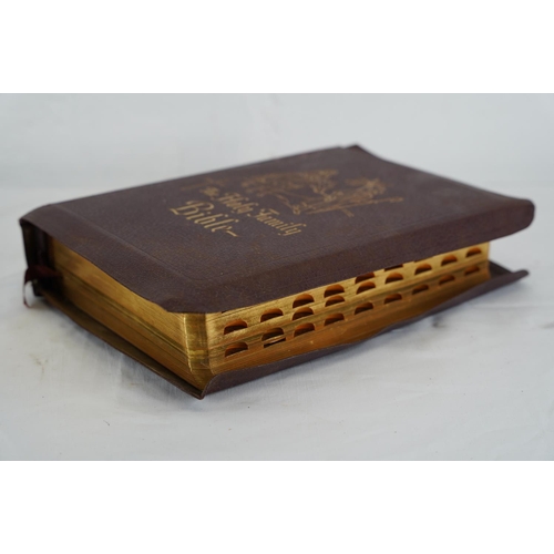 386 - A large Family Bible, measuring 30cm x 19cm.