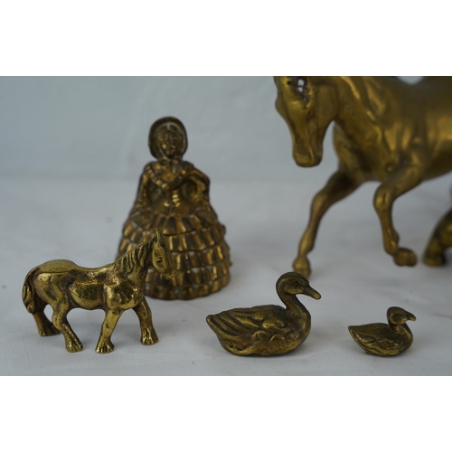 394 - A vintage brass horse, two novelty brass bells and more.