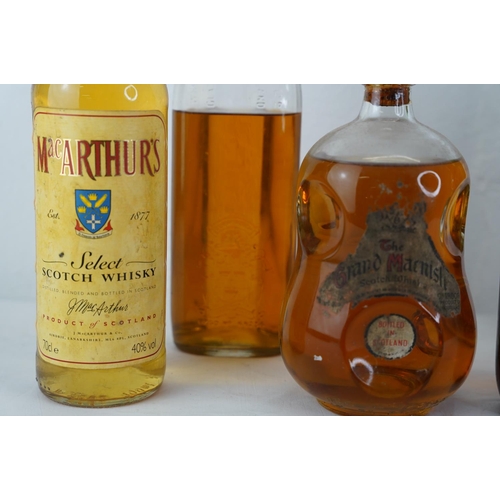 409 - A bottle of MacArthur's Scotch Whisky, a bottle of Whites Irish Whiskey, a bottle of Black & White S... 