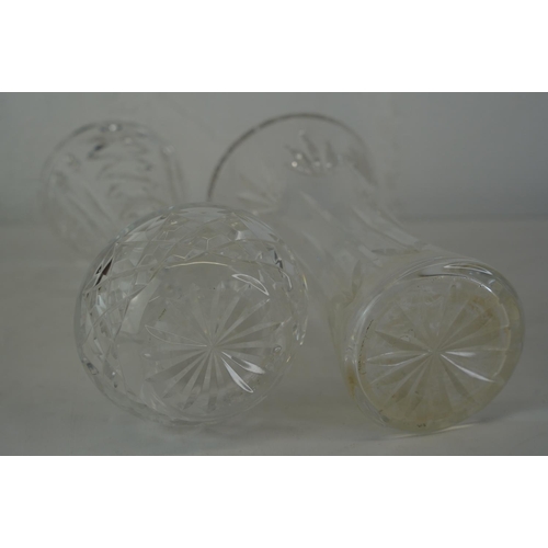 414 - Two Waterford crystal vases, measuring 25cm and 20cm.