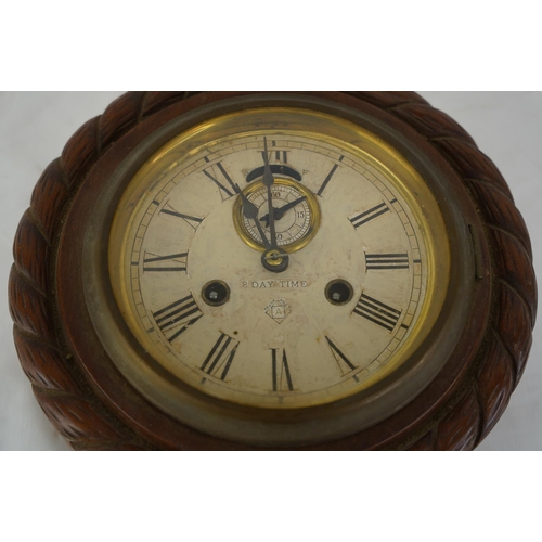 440 - A vintage wooden cased Ansonia 8 day wall clock.