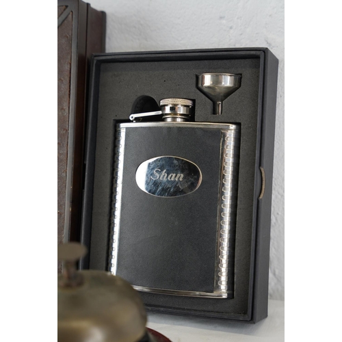 442 - Two shop bells, a boxed 'Shan' hipflask and a boxed magnifying glass and letter opener set.