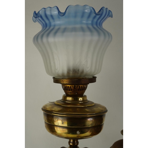 474 - A vintage Corinthian oil lamp with blue etched glass shade and two oil lamp bases.