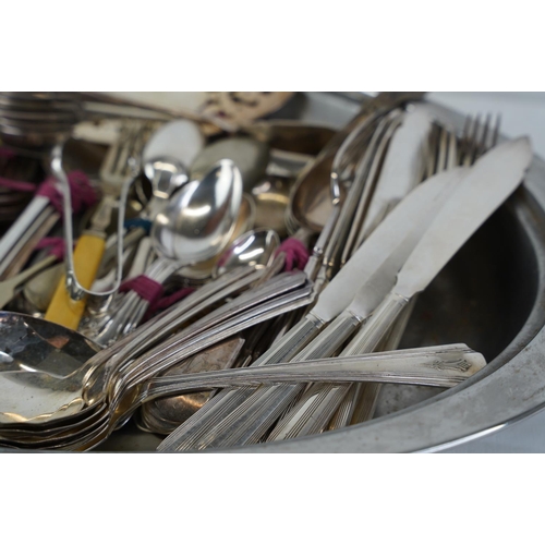 478 - A very large lot of plated cutlery and a metal serving platter.