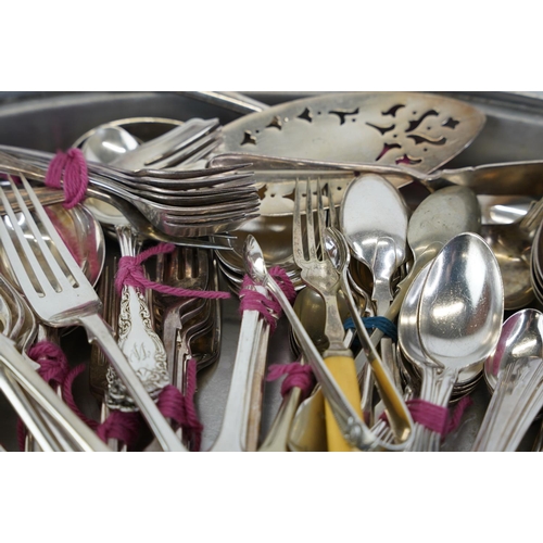 478 - A very large lot of plated cutlery and a metal serving platter.