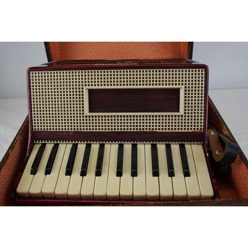 482 - A cased Monika accordion.