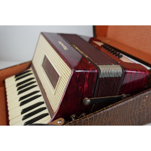 482 - A cased Monika accordion.