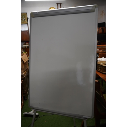 486 - A floor standing white board, measuring 103cm x 70cm.