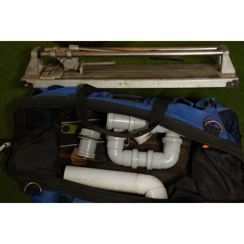 491 - A tool bag and a tile cutter.