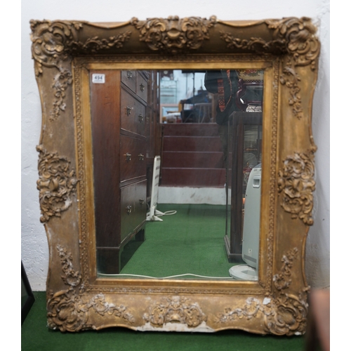 494 - A large antique heavy framed wall mirror with decorative gilt frame.. 1,6 meters x 88cm