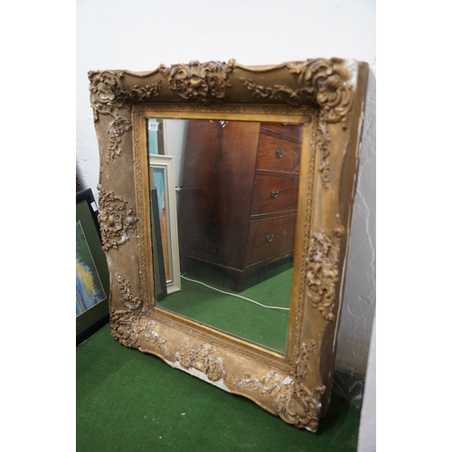 494 - A large antique heavy framed wall mirror with decorative gilt frame.. 1,6 meters x 88cm