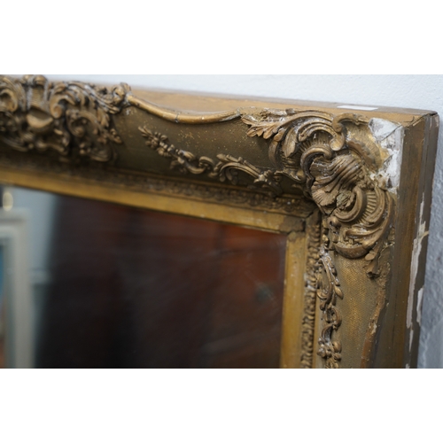 494 - A large antique heavy framed wall mirror with decorative gilt frame.. 1,6 meters x 88cm