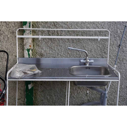 495 - A galvanised sink unit and stand