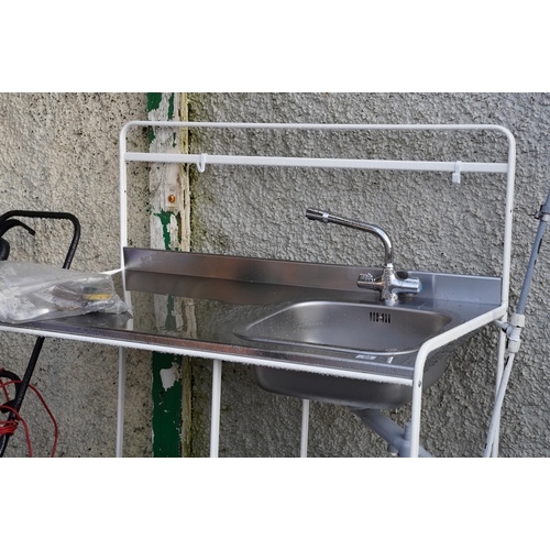 495 - A galvanised sink unit and stand