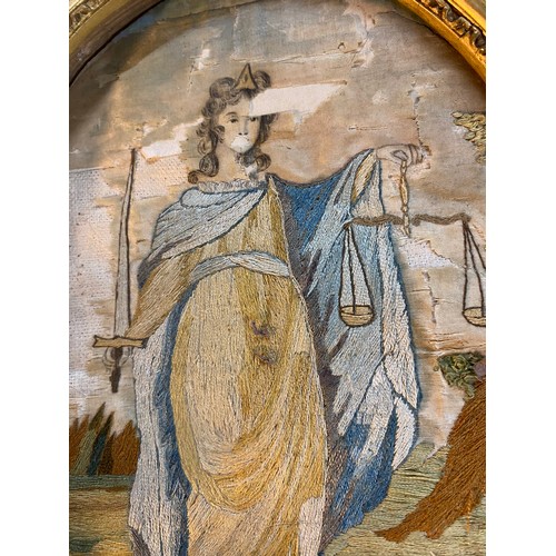 190 - An antique framed oval handstitched panel of Lady Justice (a/f)