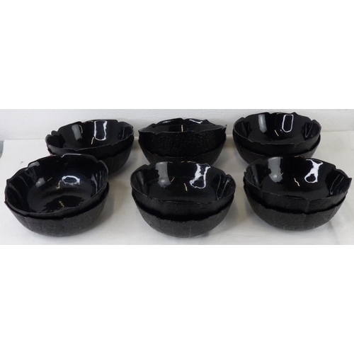 63 - A set of 12 vintage black glass 'cabbage leaf' bowls.