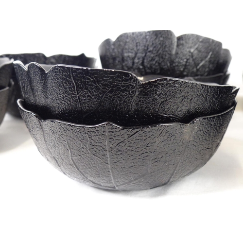63 - A set of 12 vintage black glass 'cabbage leaf' bowls.