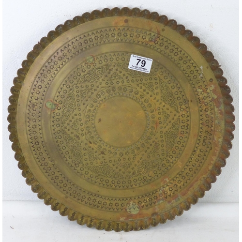 79 - A large decorative brass tray, measuring 39cm