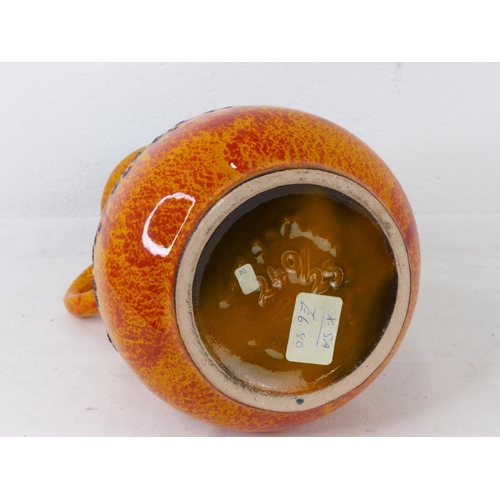 85 - A vintage pottery handled vase.