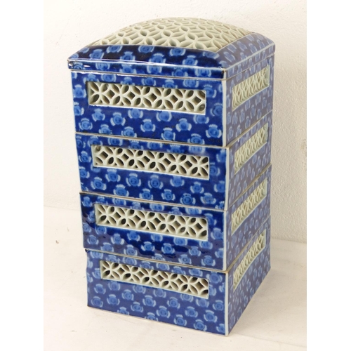 87 - A set of four Oriental style stacking boxes (a/f).