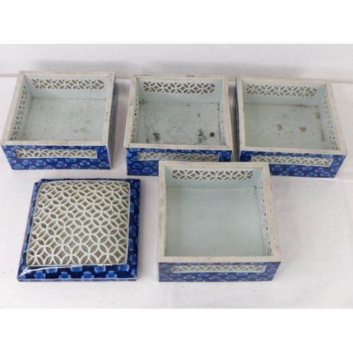 87 - A set of four Oriental style stacking boxes (a/f).